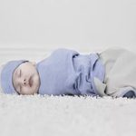 Merino Kids baby dressed in Cocooi Babywrap Set in Sky Blue Swaddle and Beanie