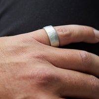 HerbertandWilks Textured Wide Silver Band Ring being worn